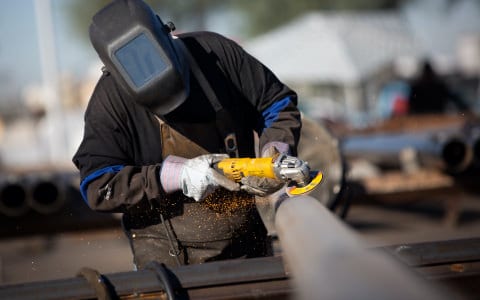 Man Working on Steel Poles